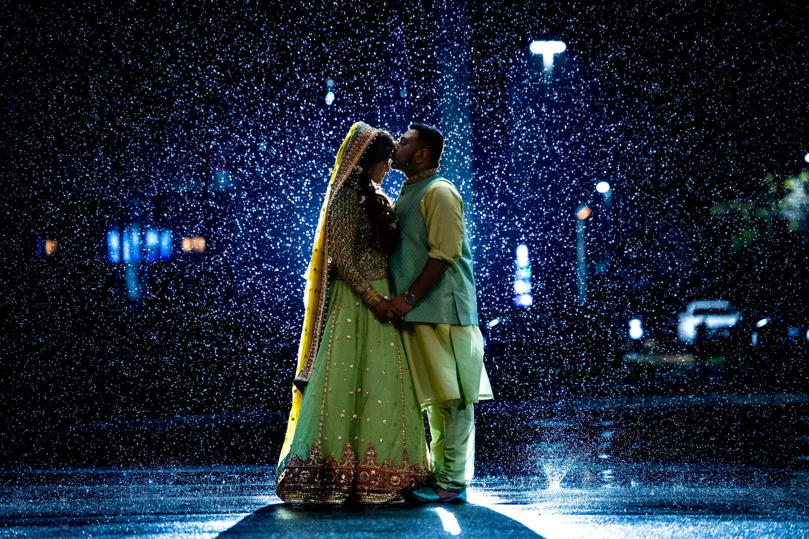 Photo of a couple in the rain in a Muslim Wedding in New Jersey